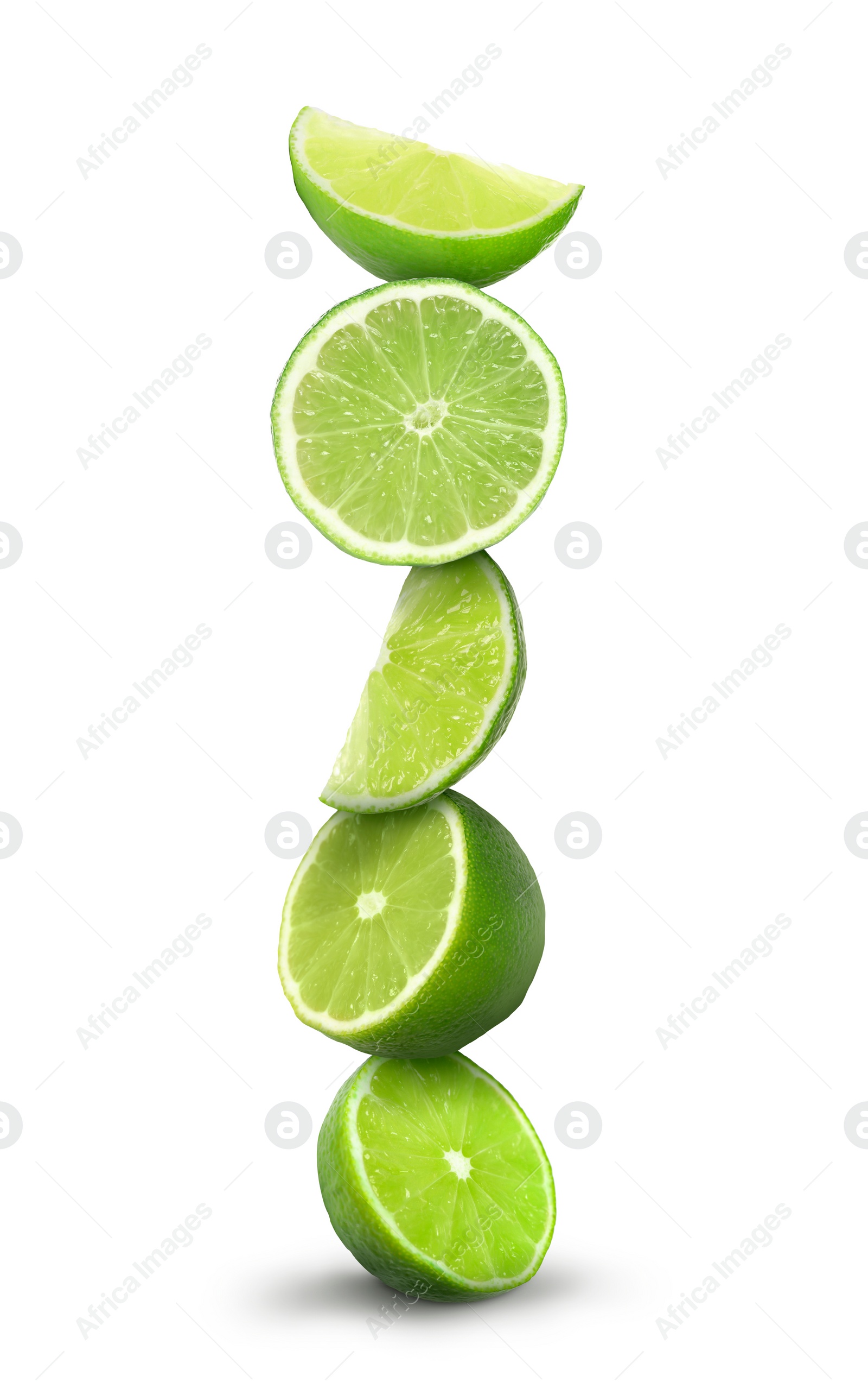 Image of Many stacked cut limes on white background