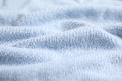 Warm cashmere sweater as background, closeup view