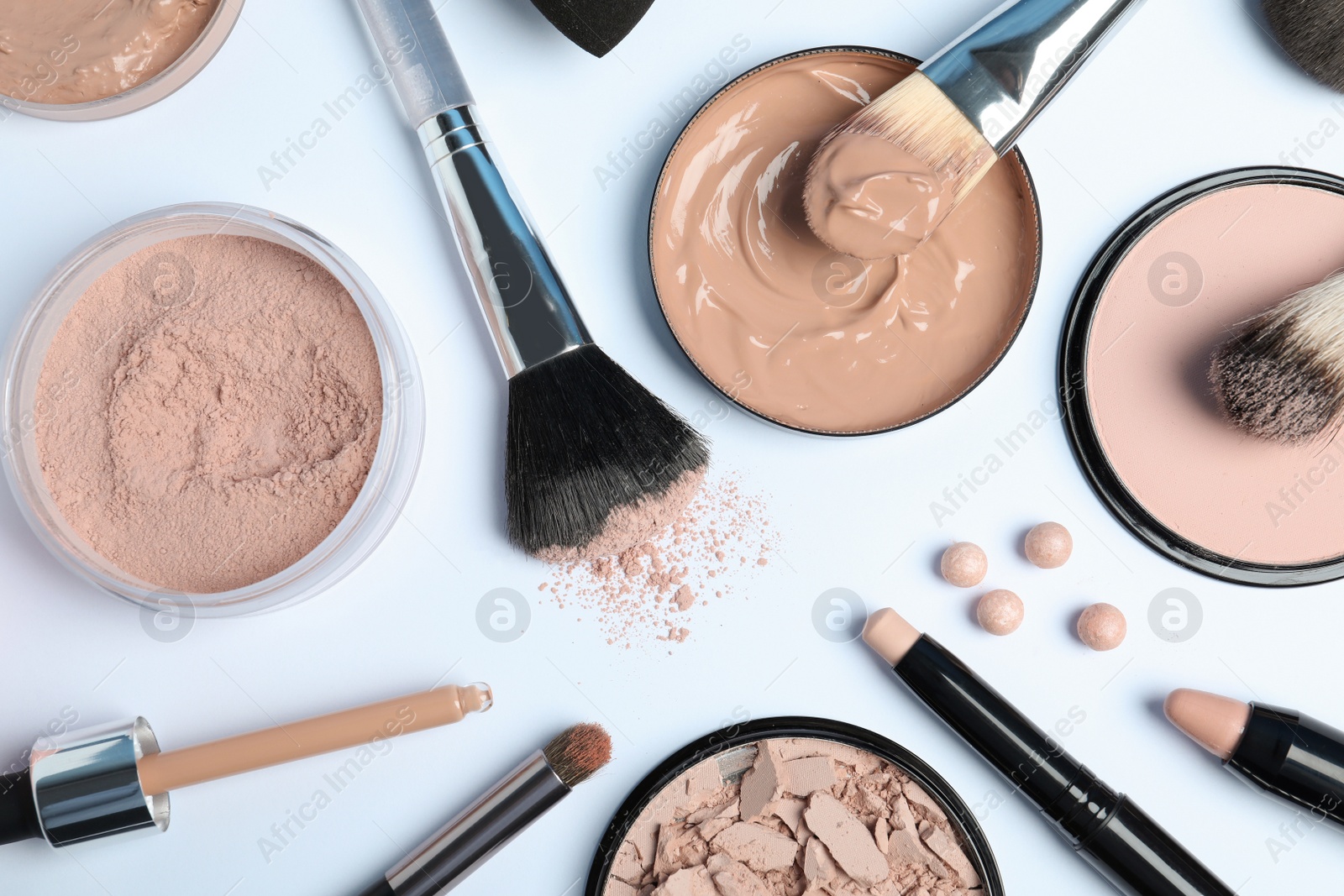 Photo of Flat lay composition with skin foundation, powder and beauty accessories on white background