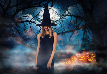 Image of Witch with spooky Jack O Lantern pumpkins and misty forest under full moon on Halloween