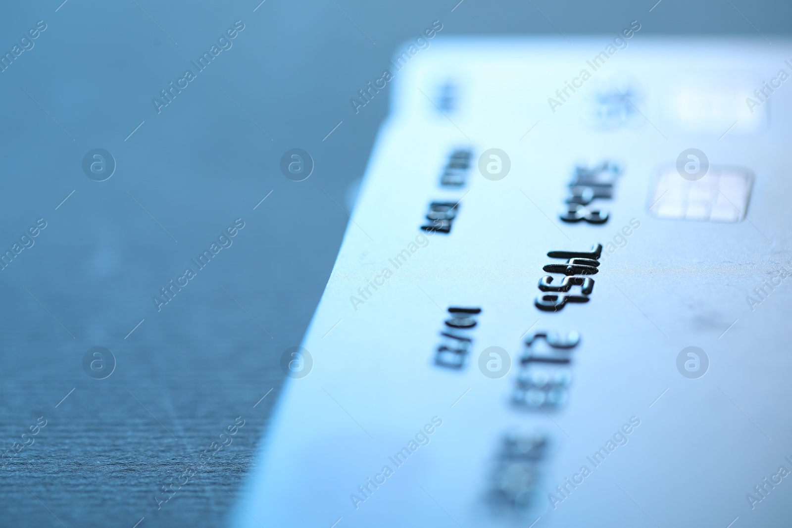 Photo of Credit card on table, closeup. Space for text