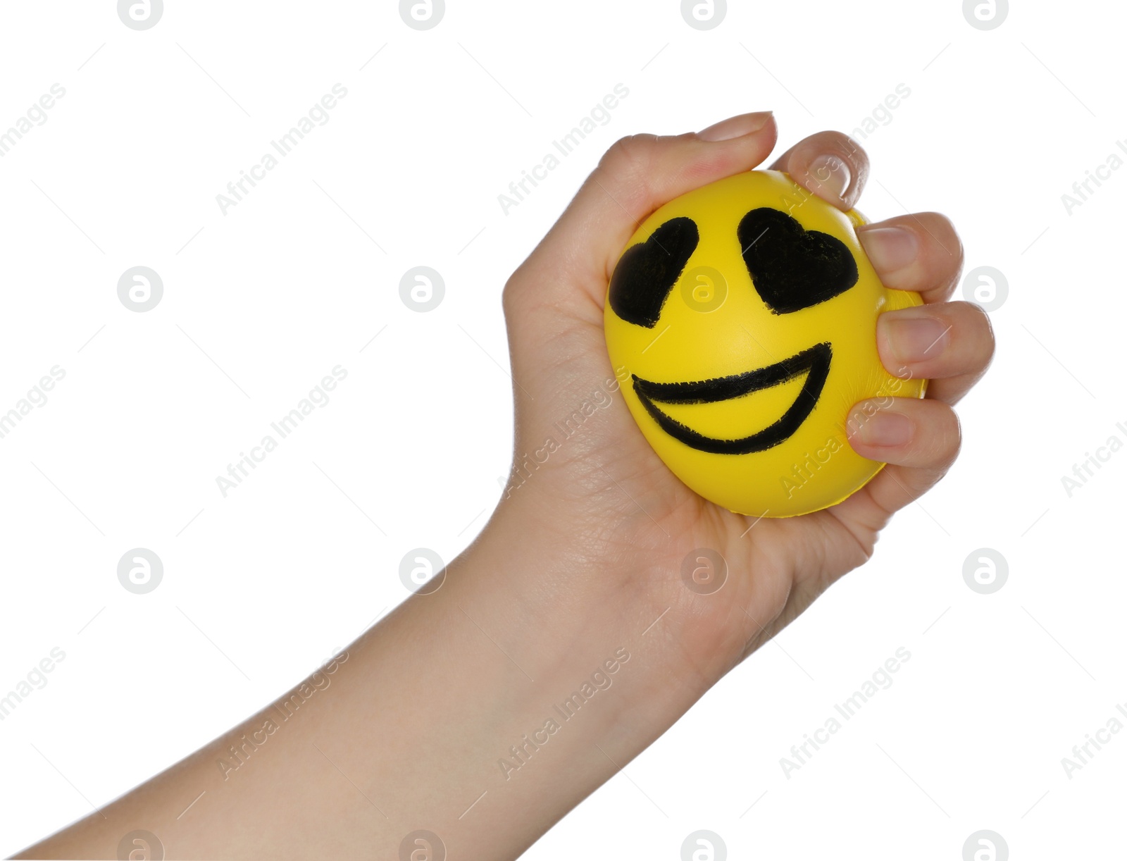 Photo of Woman squeezing antistress ball with funny face on white background, closeup