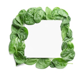 Photo of Fresh green healthy baby spinach leaves and blank card on white background, top view. Space for text