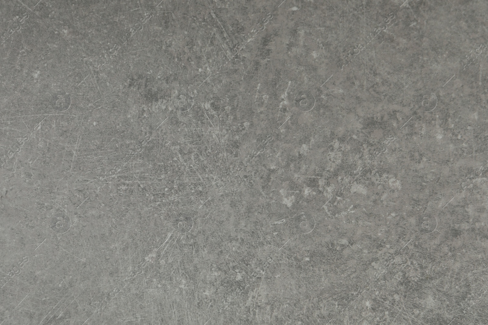 Photo of Texture of light grey stone surface as background, closeup