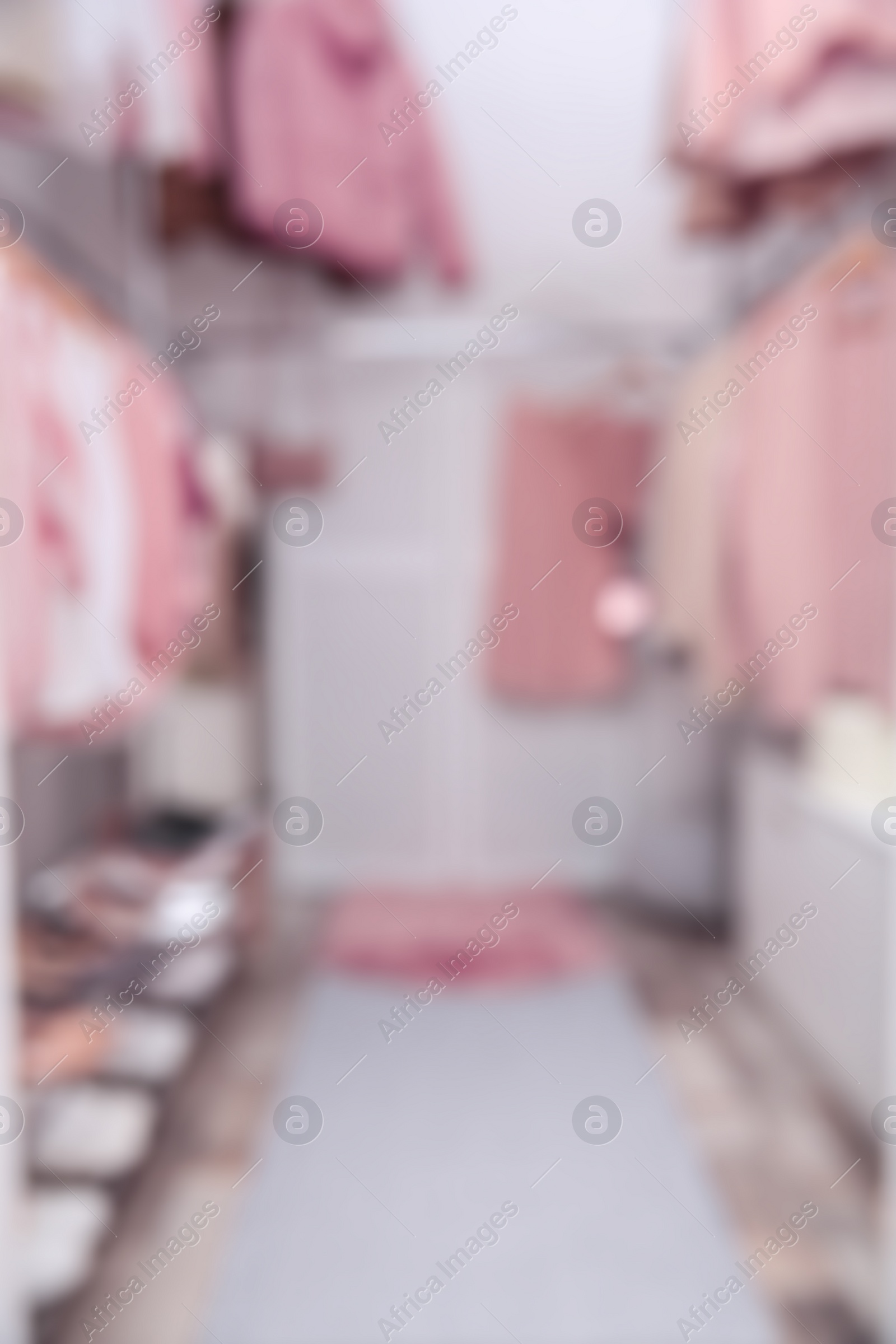 Photo of Blurred view of modern dressing room with different stylish clothes and accessories