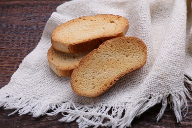 Photo of Tasty hard chuck crackers on wooden table