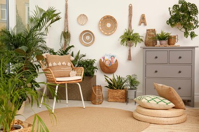 Photo of Room interior with stylish furniture and green plants