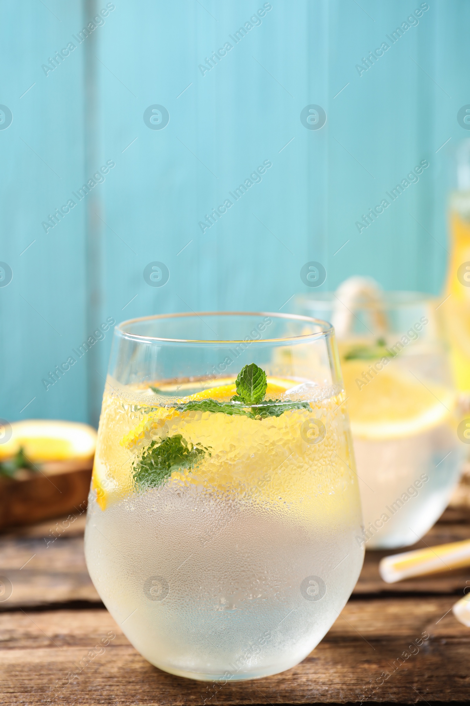 Photo of Delicious refreshing citrus drink on wooden table