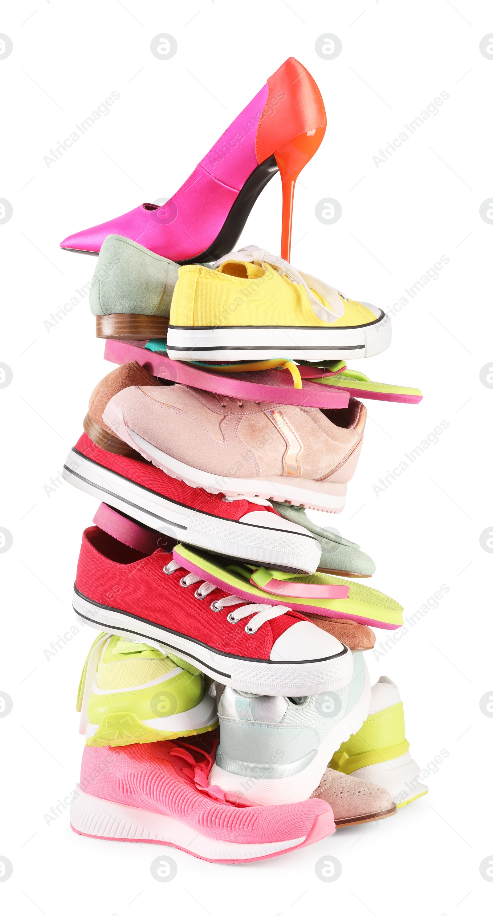 Photo of Stack of various female shoes isolated on white