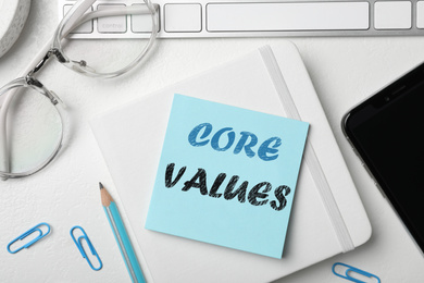 Image of Core values concept. Flat lay composition with stationery on white table 