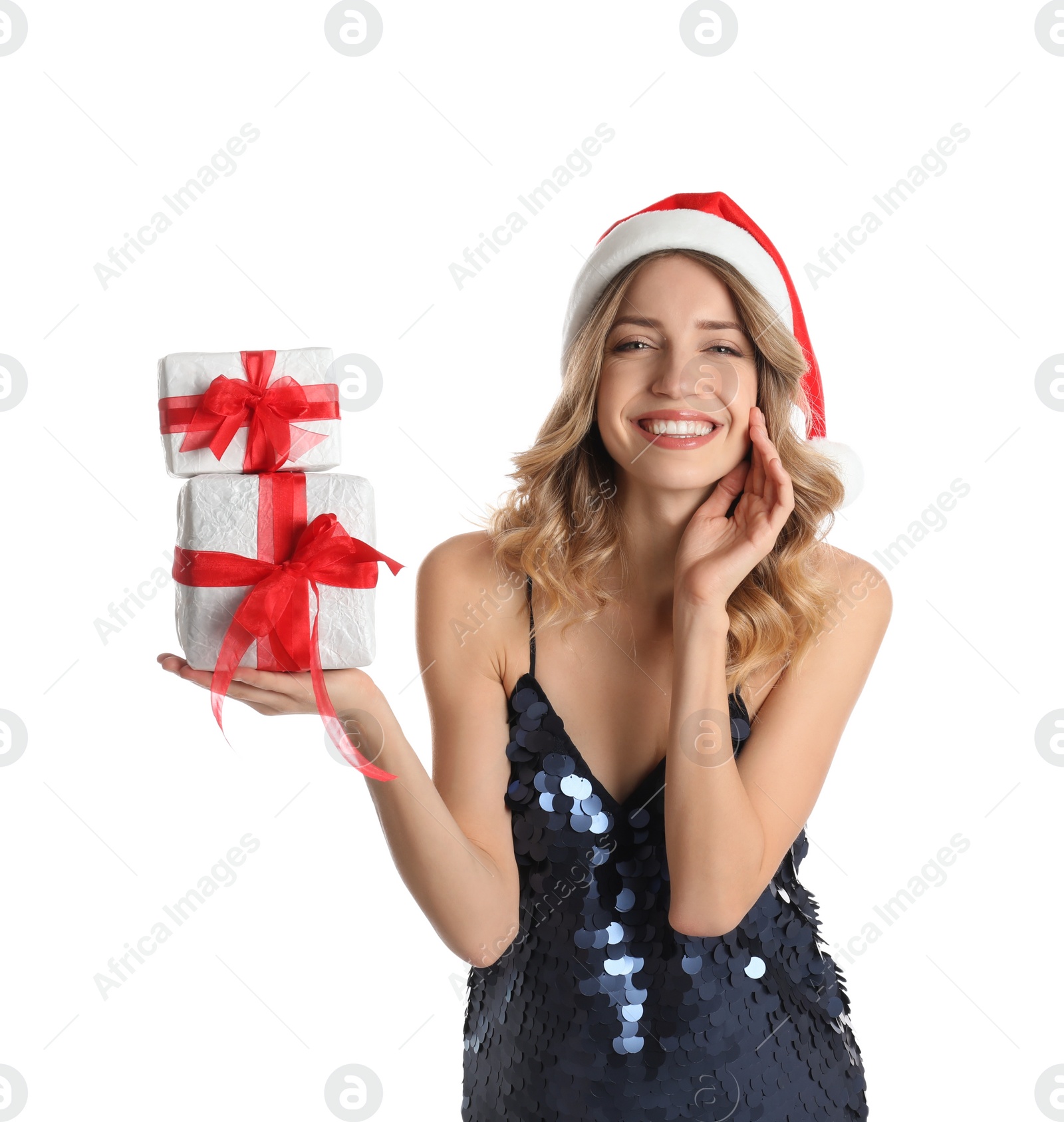 Photo of Beautiful young woman in Santa hat with Christmas presents on white background