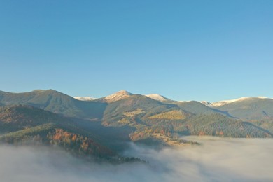 Photo of Beautiful landscape with thick mist in mountains. Drone photography