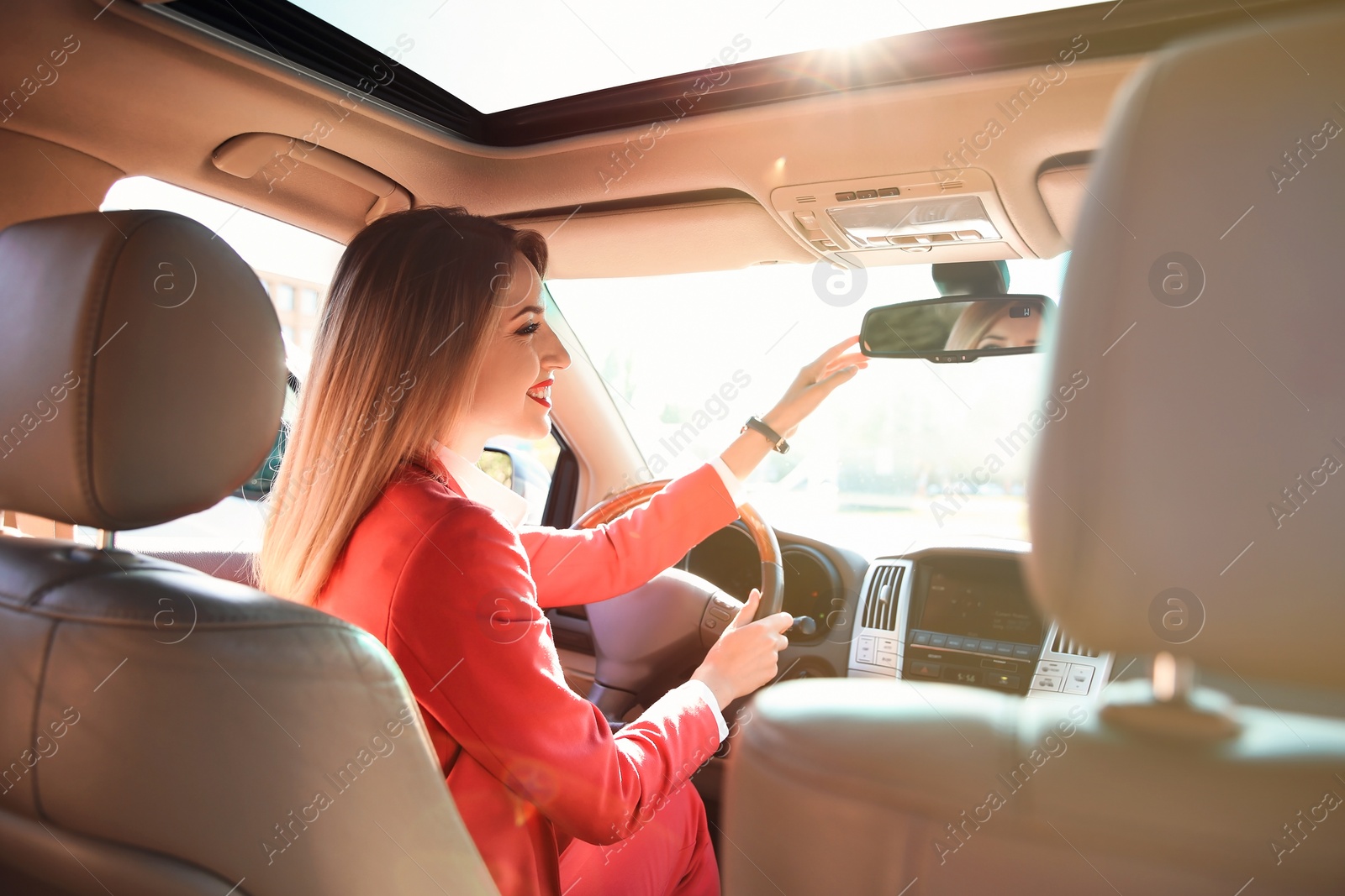 Photo of Young businesswoman on driver's seat of car