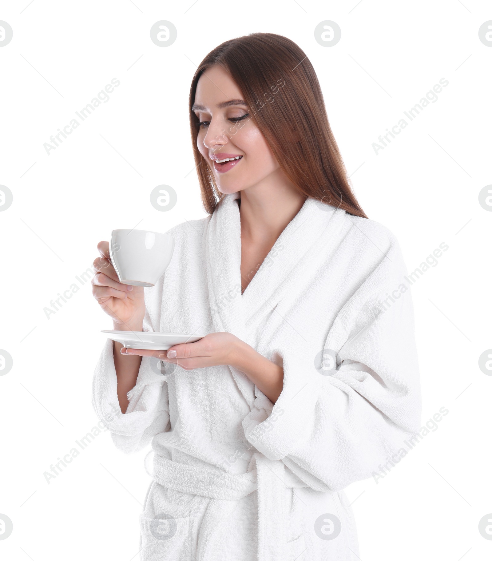 Photo of Young woman in bathrobe with cup of drink on white background