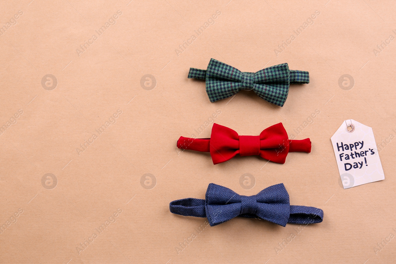 Photo of Bow ties on color background. Father's day celebration