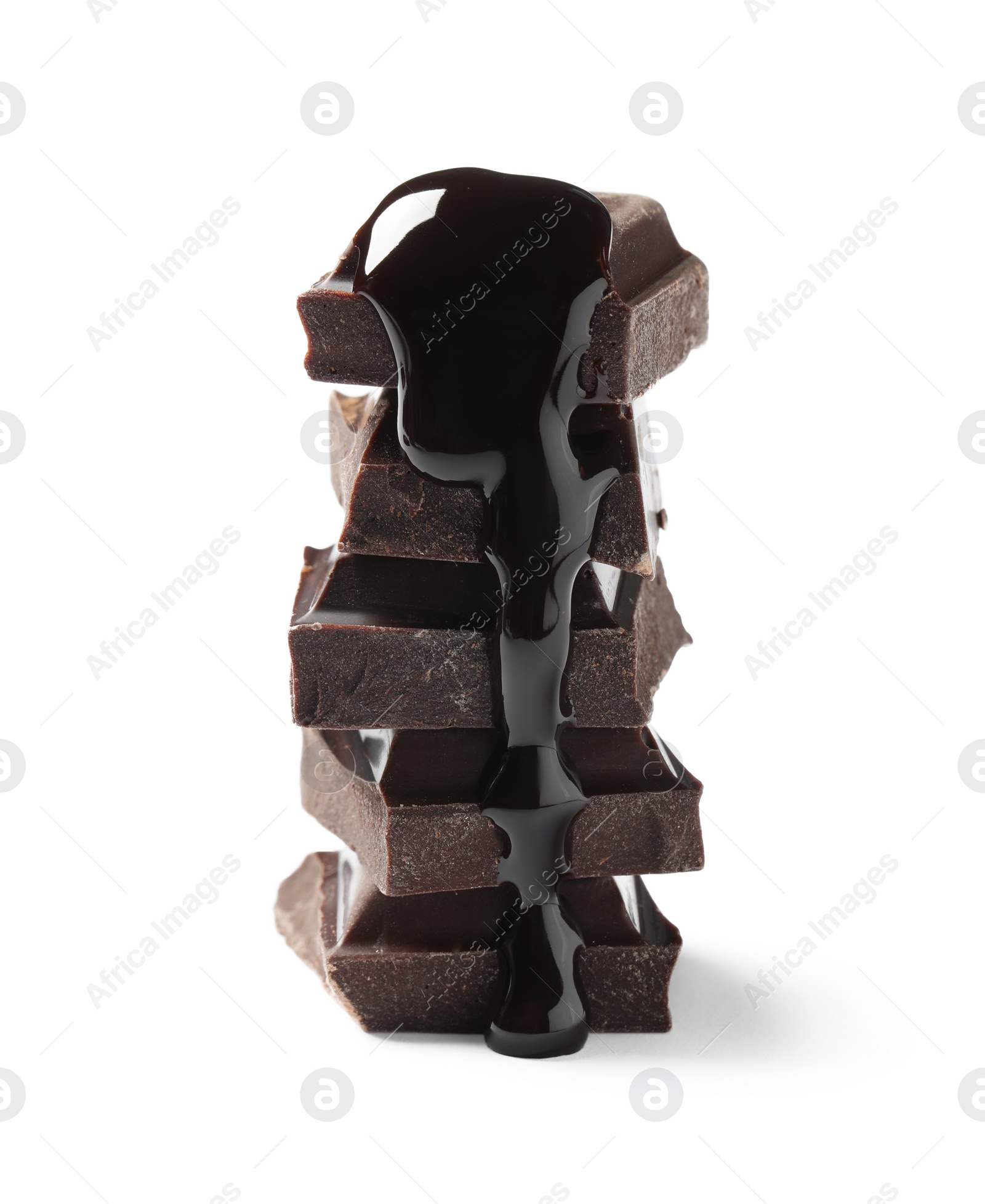 Photo of Pieces of delicious dark chocolate with syrup isolated on white