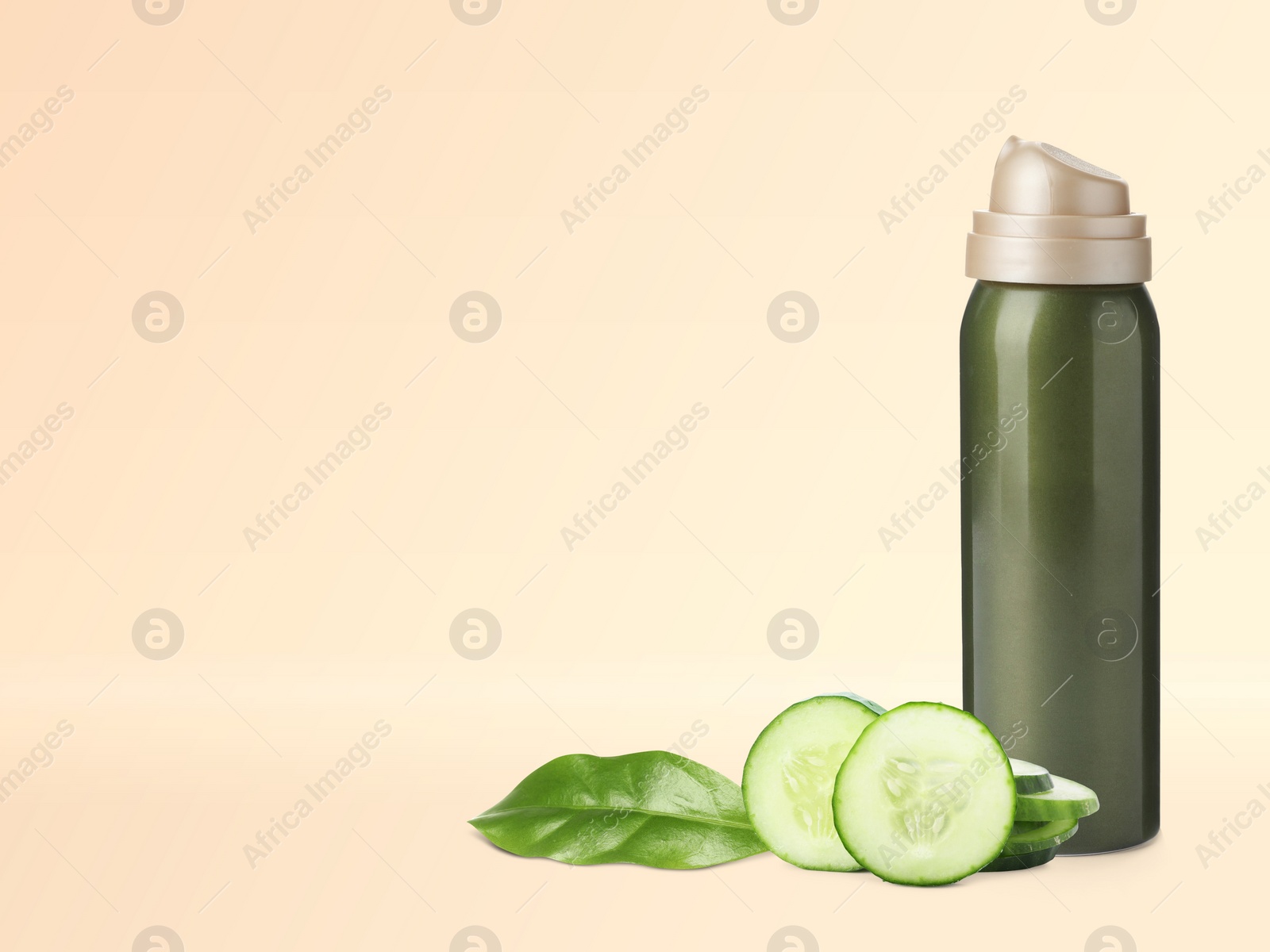 Image of Makeup remover, fresh cucumber and green leaf on beige background. Space for text 