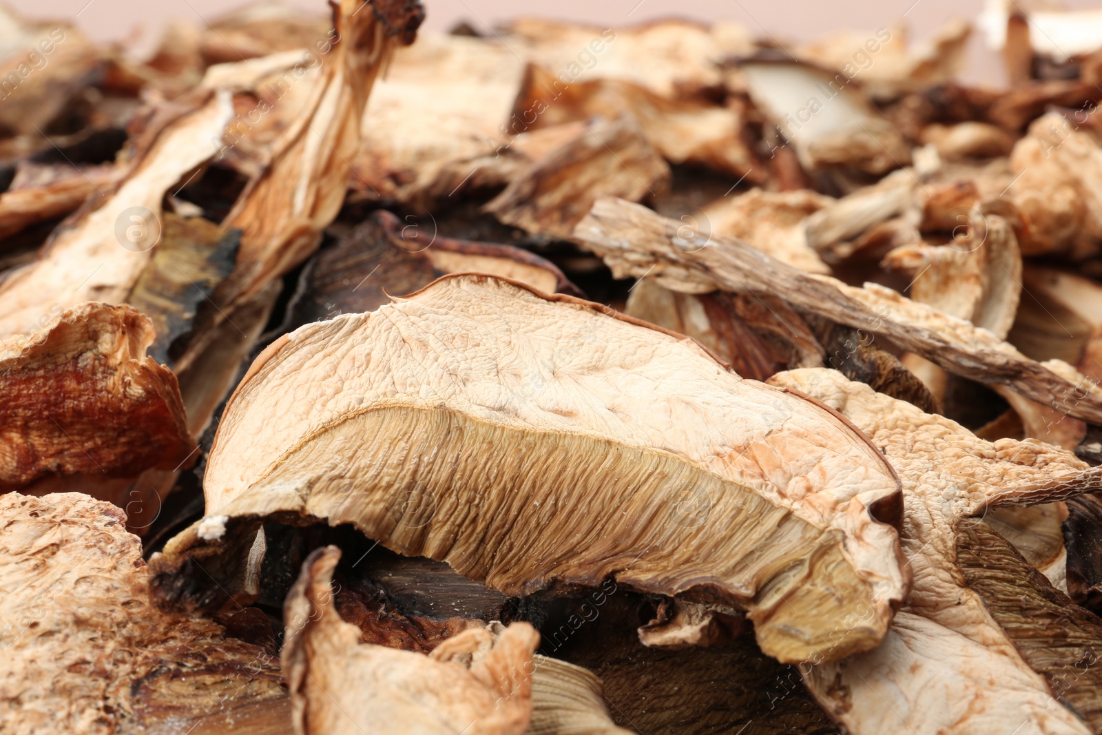 Photo of Delicious dried slices of mushrooms as background, closeup view