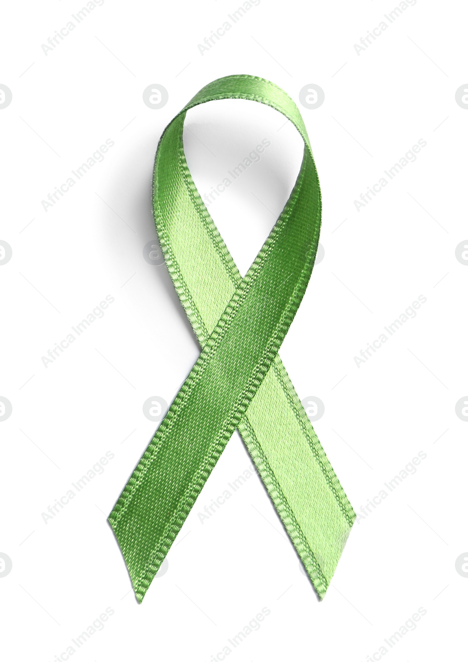 Photo of Green ribbon on white background, top view. Cancer awareness