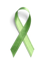 Green ribbon on white background, top view. Cancer awareness