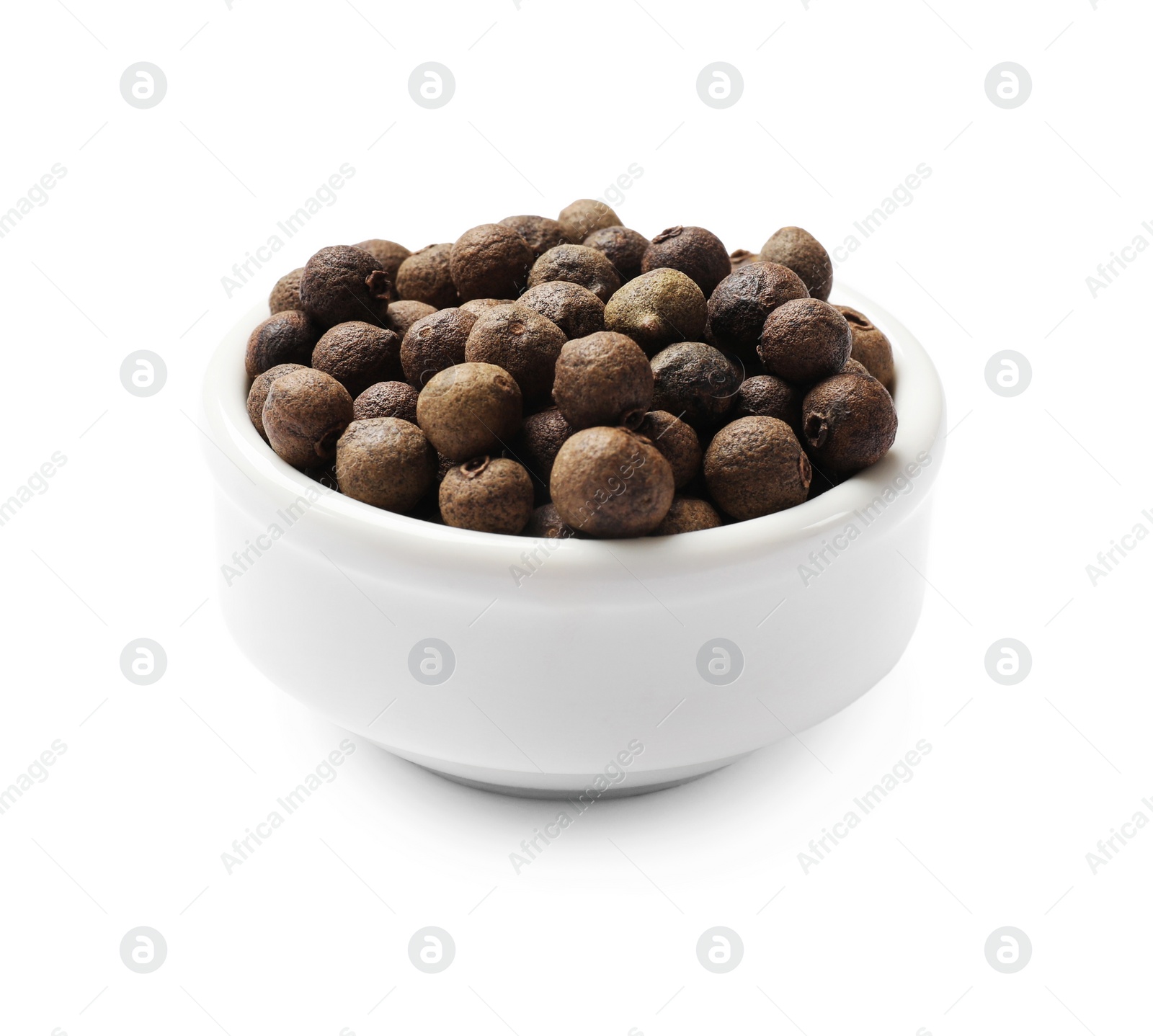 Photo of Dry allspice berries (Jamaica pepper) in bowl isolated on white