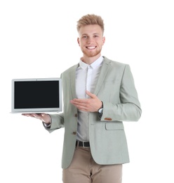 Young man with laptop on white background. Space for text