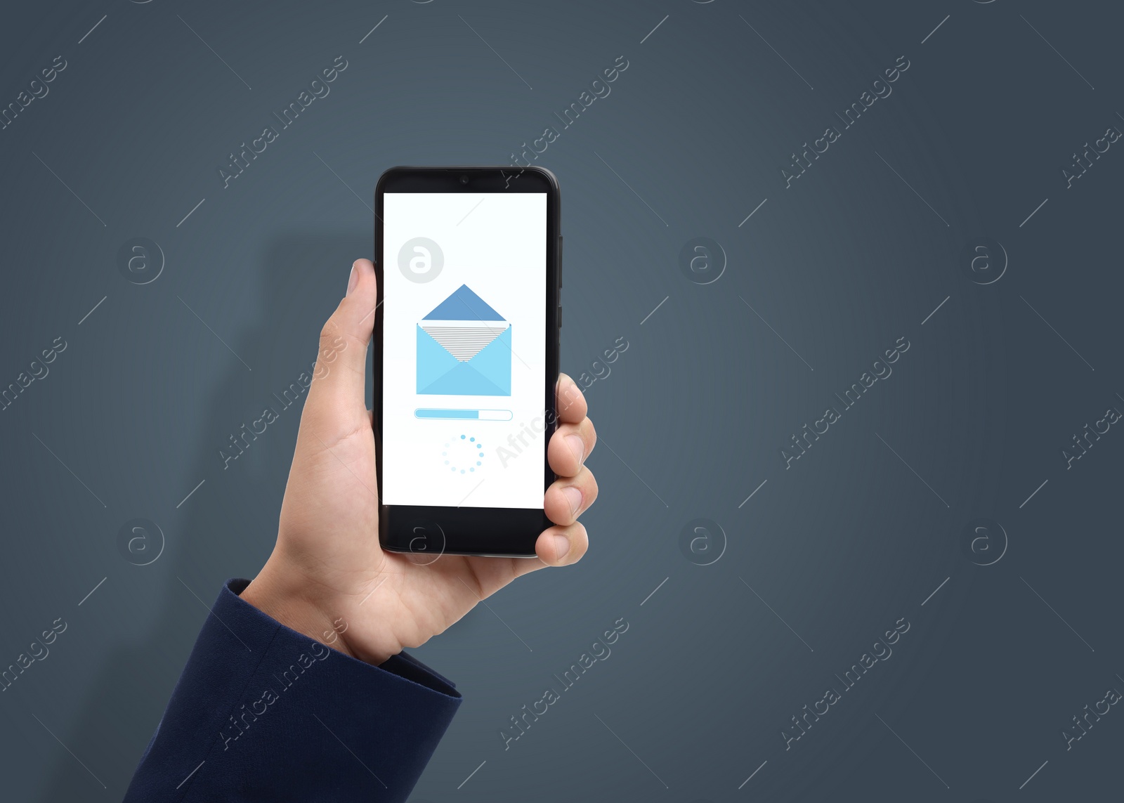 Image of Got new message. Man holding smartphone on grey background, closeup. Space for text