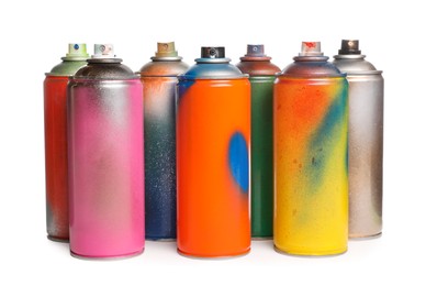 Photo of Used cans of spray paints on white background