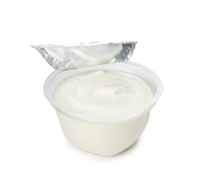 Plastic cup with creamy yogurt on white background