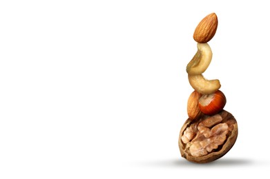 Stack of different nuts on white background