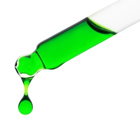 Photo of Dripping green facial serum from pipette on white background, closeup