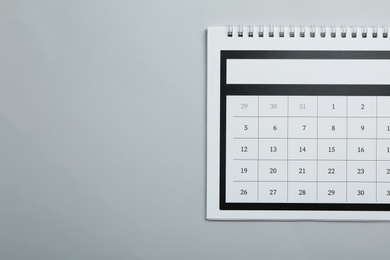Paper calendar on light grey background, top view. Space for text