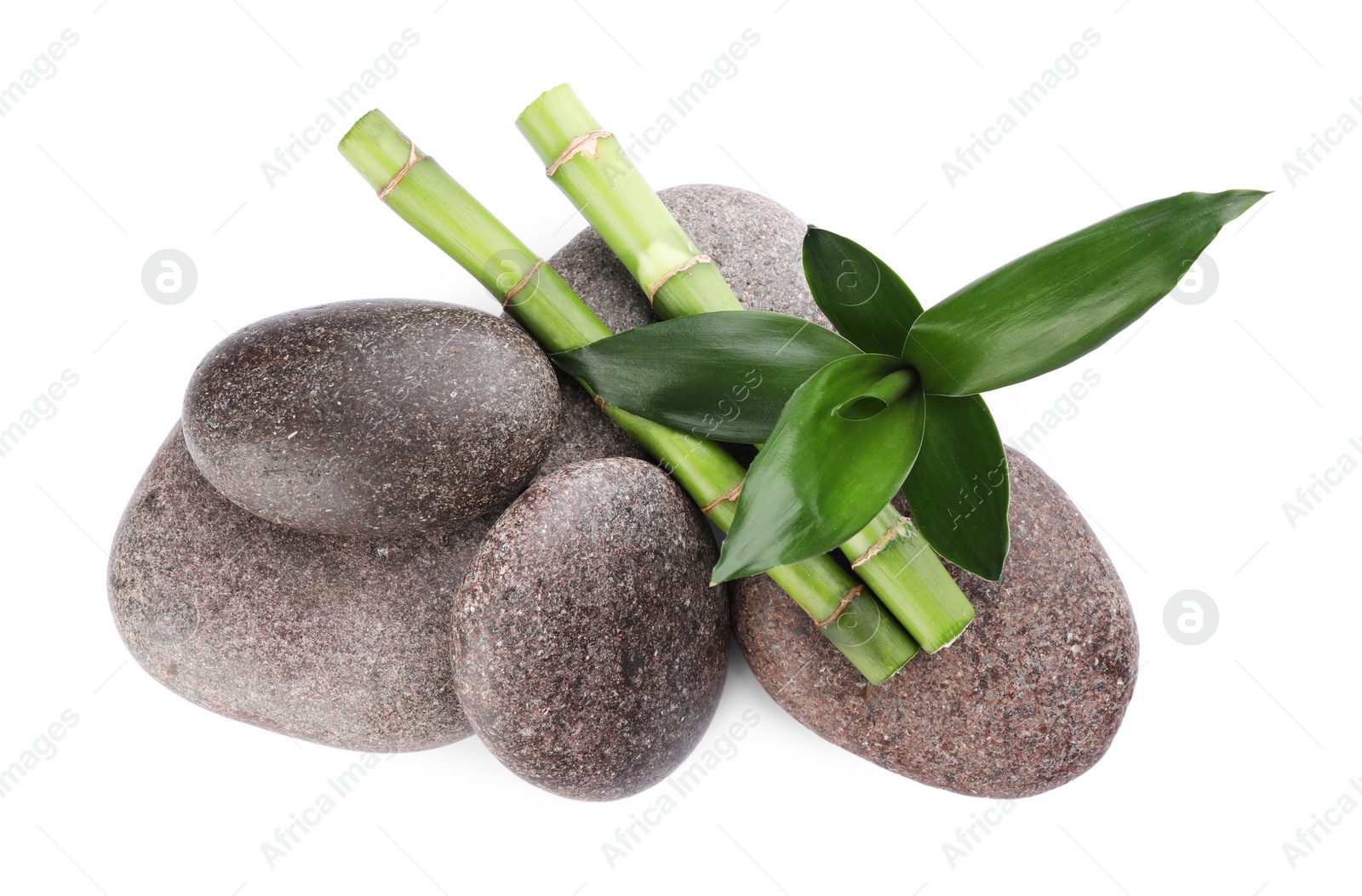 Photo of Spa stones and bamboo on white background, top view