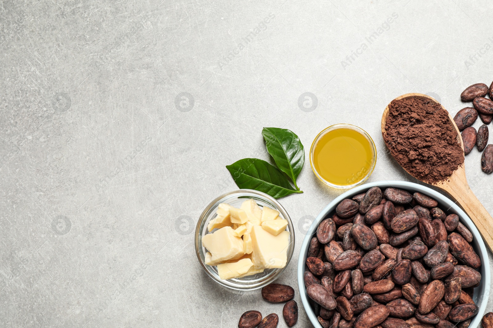 Photo of Flat lay composition with organic cocoa butter on light grey table. Space for text