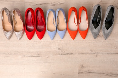 Photo of Different female shoes on floor