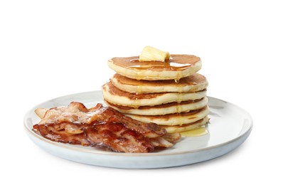 Delicious pancakes with maple syrup, butter and fried bacon on white background