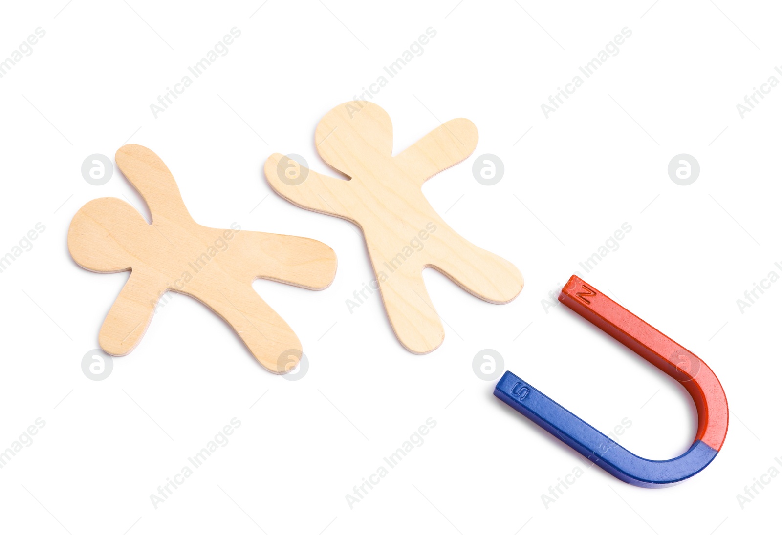 Photo of Red and blue horseshoe magnet with wooden people figures on white background, top view