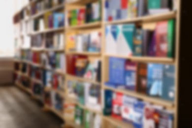 Photo of Blurred view of different books on shelves in library