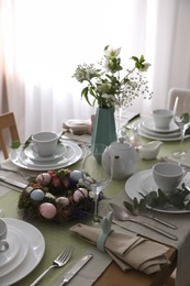 Beautiful Easter table setting with festive decor indoors