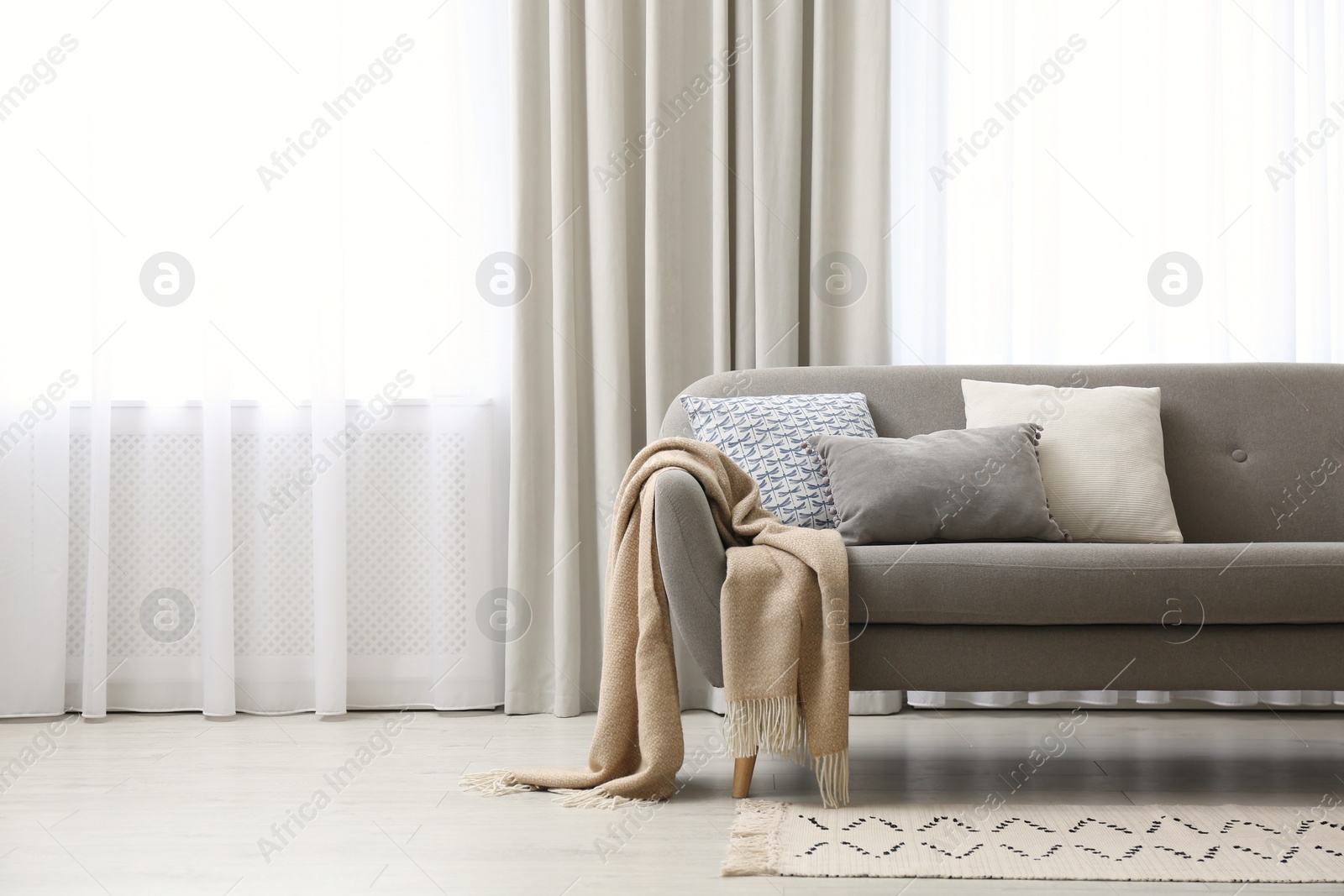 Photo of Modern living room interior with beautiful curtains on window