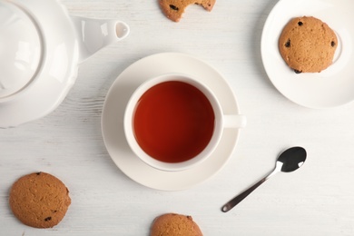 Photo of Flat lay composition with delicious tea on wooden background