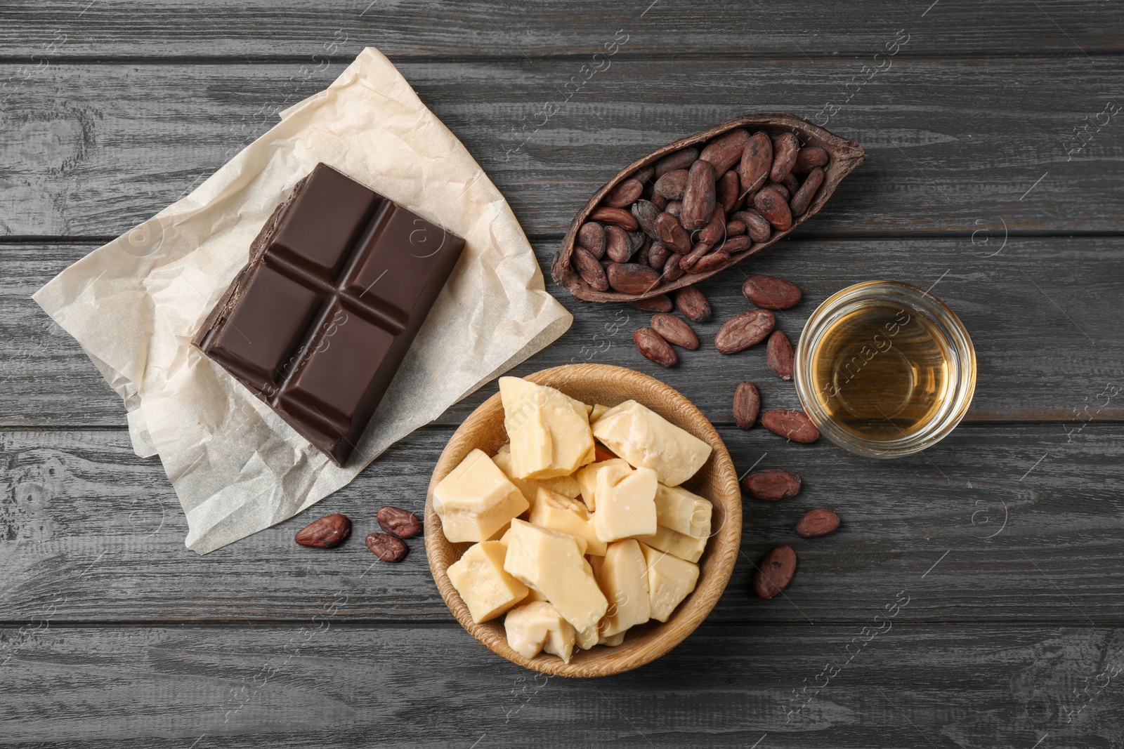 Photo of Flat lay composition with organic cocoa butter on black wooden table