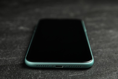 MYKOLAIV, UKRAINE - JULY 9, 2020: New modern Iphone 11 on black background, closeup