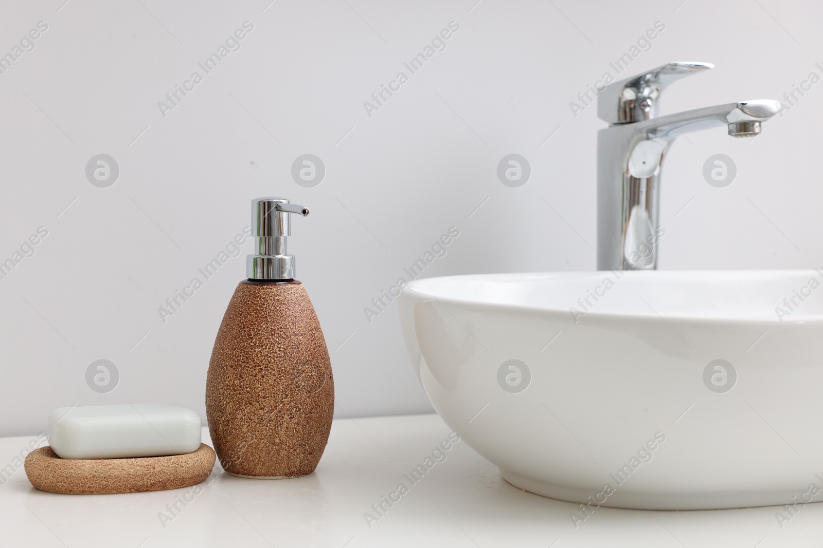 Photo of Set of different bath accessories and products on white table