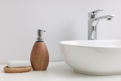 Photo of Set of different bath accessories and products on white table