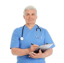 Photo of Portrait of male doctor in scrubs with clipboard isolated on white. Medical staff