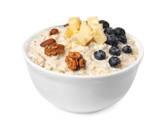 Photo of Tasty boiled oatmeal with blueberries, banana and nuts in bowl isolated on white
