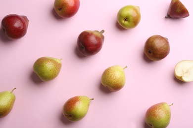 Ripe juicy pears on pink background, flat lay