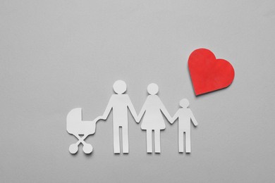 Photo of Paper family cutout and red heart on grey background, flat lay. Insurance concept