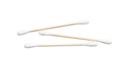 Photo of Wooden cotton buds on white background, top view